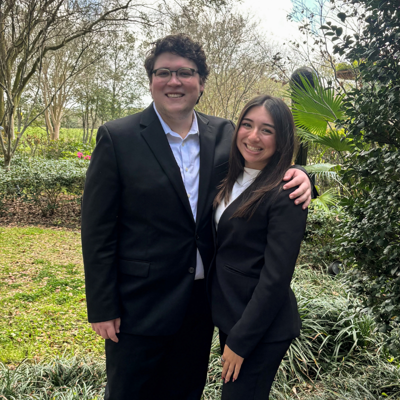 Two students outdoors.