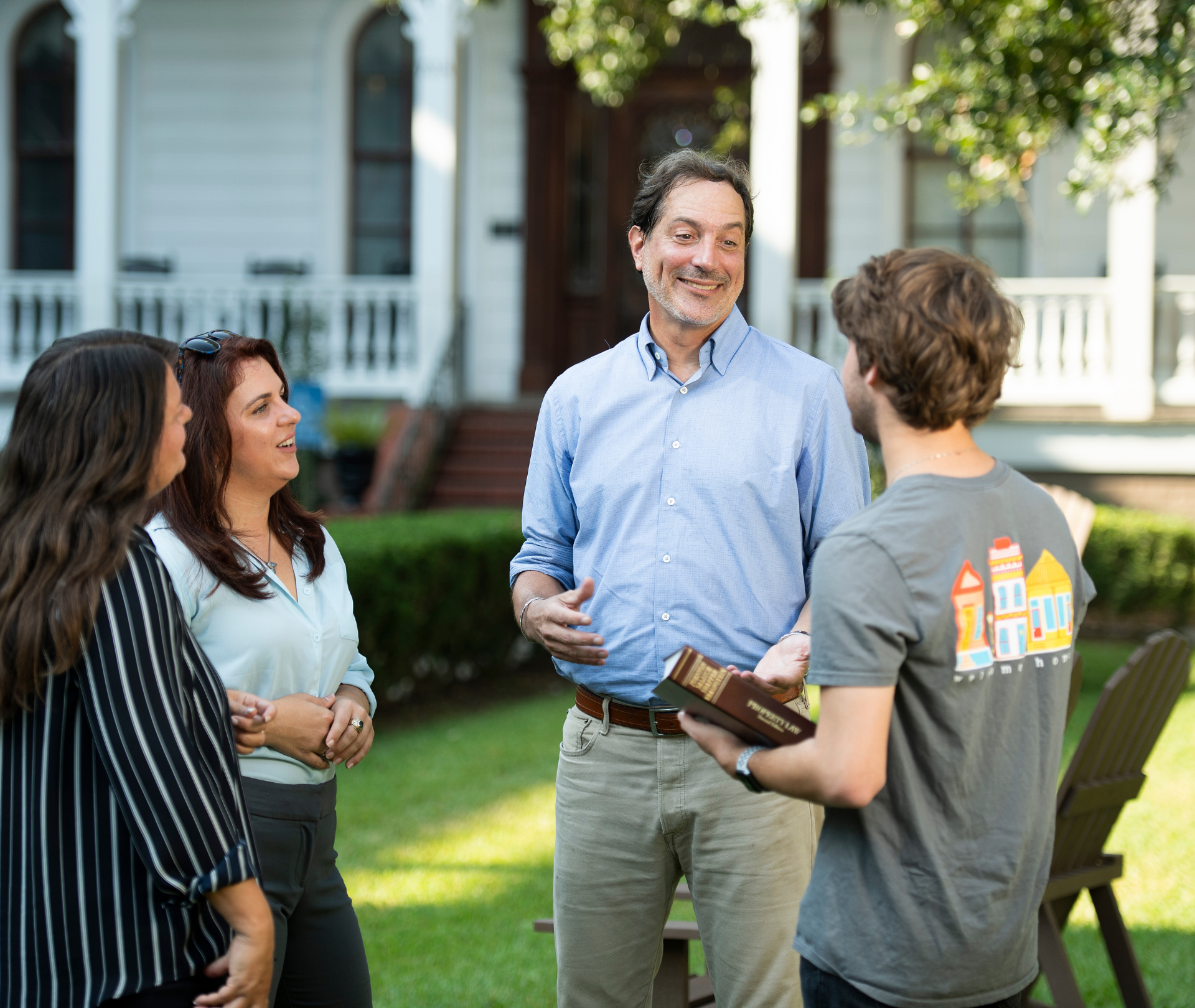 Professor Verchick talks to students outside.