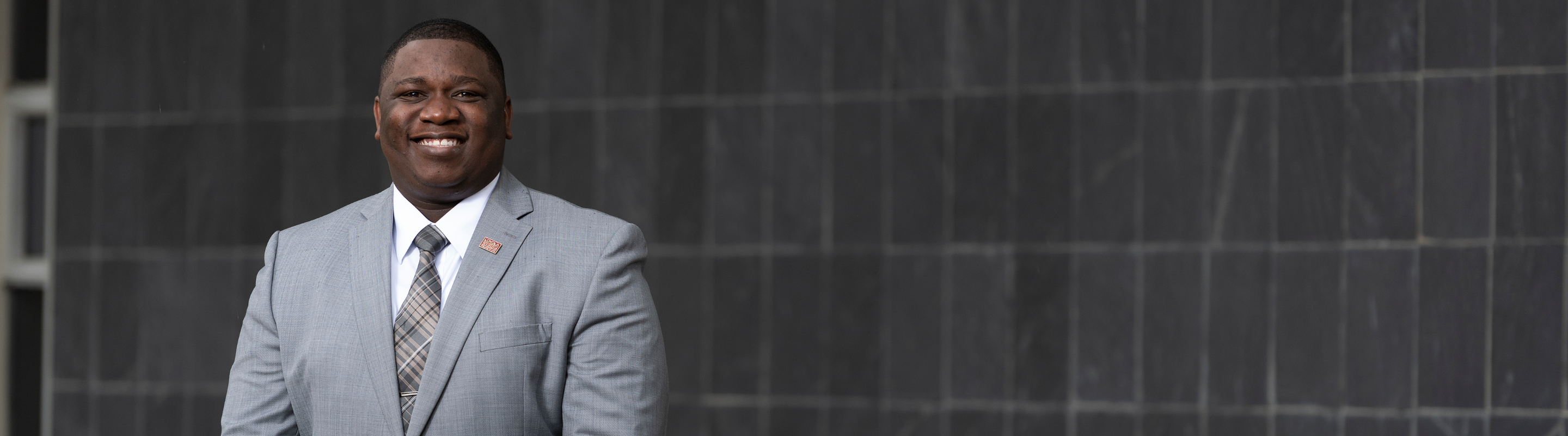 Man in suit smiling